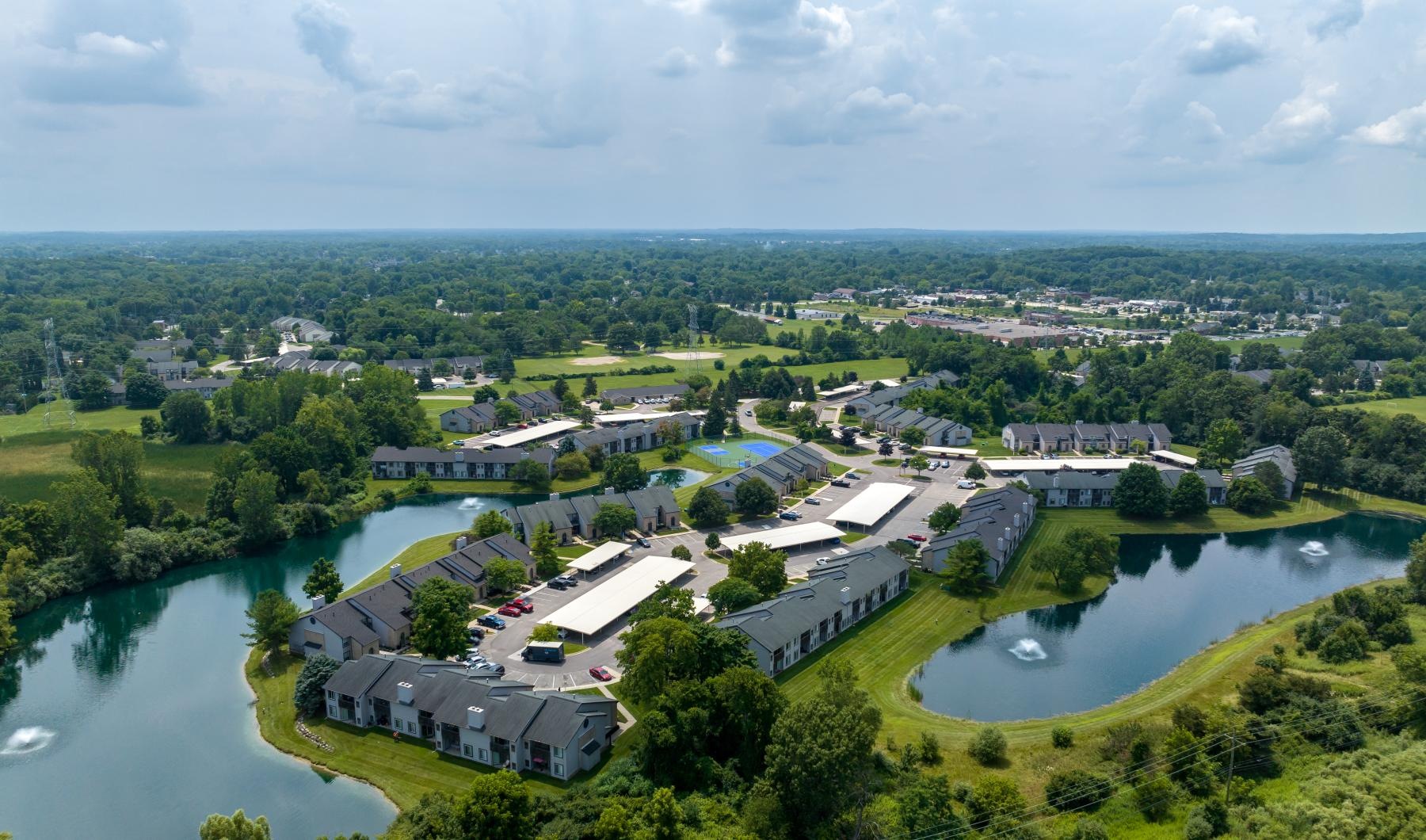 a river with buildings and trees