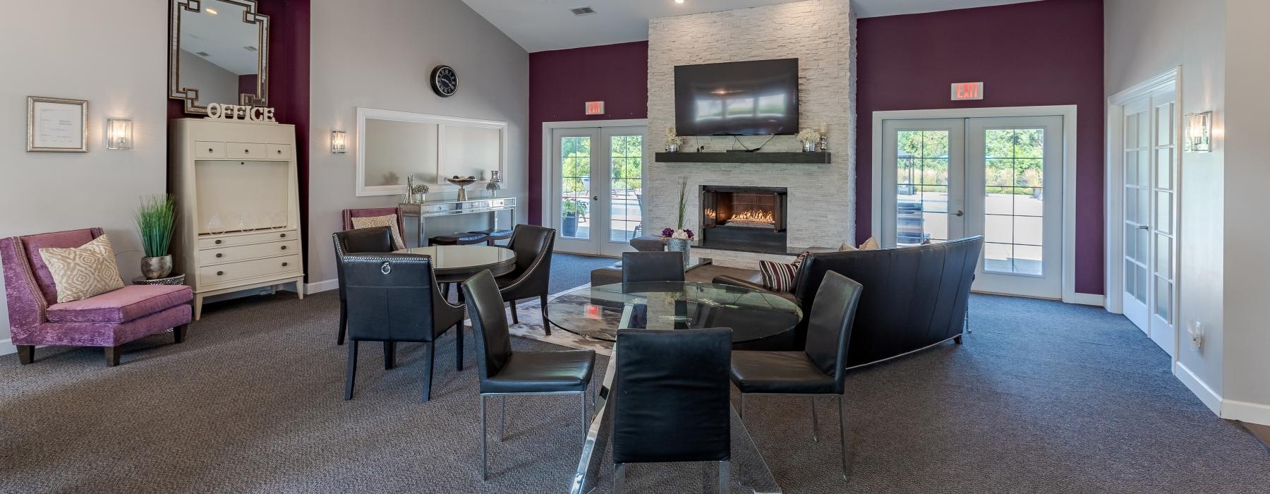 a social room with a fireplace