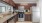 a kitchen with wooden cabinets