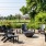 a patio with chairs and a firepit