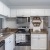 a kitchen with white cabinets